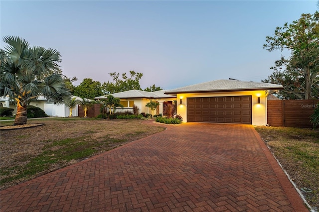 ranch-style home featuring a garage