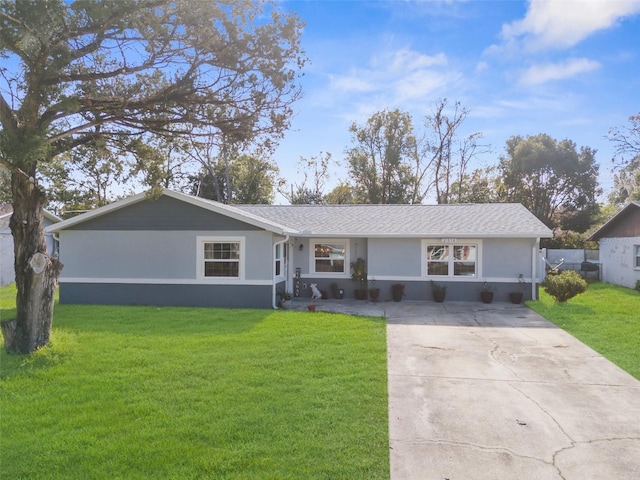 ranch-style home featuring a front yard