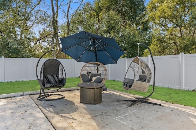 view of patio / terrace featuring an outdoor fire pit