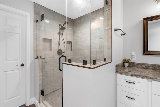 bathroom with vanity and walk in shower