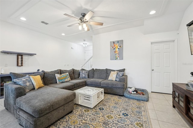 tiled living room featuring ceiling fan