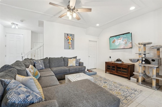 living room with light tile patterned floors and ceiling fan