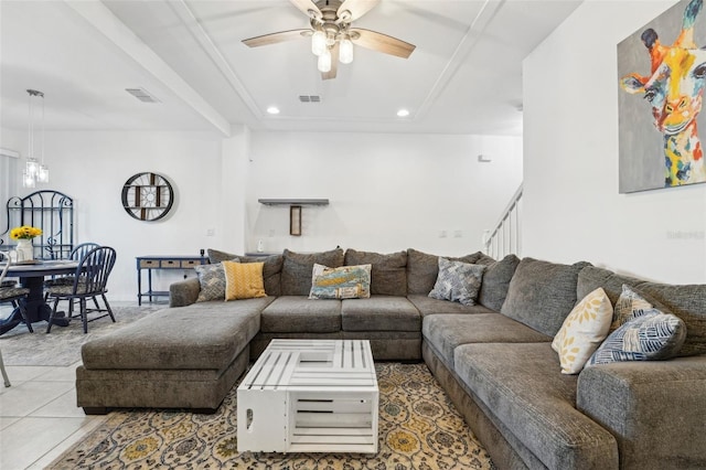 tiled living room with ceiling fan