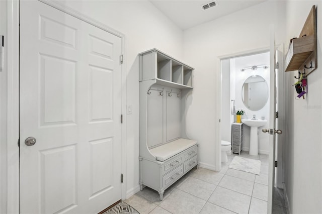 mudroom with light tile patterned floors