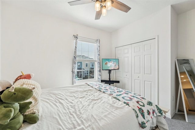 carpeted bedroom featuring a closet and ceiling fan