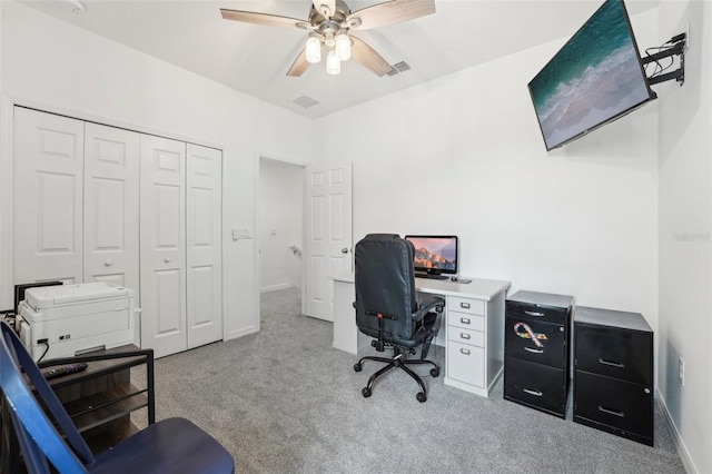 office featuring light carpet and ceiling fan