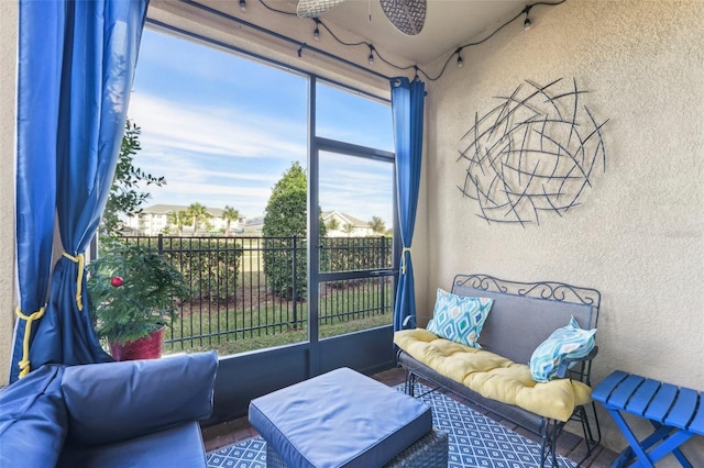 sunroom / solarium with ceiling fan