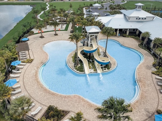 view of pool featuring a water view and a water slide