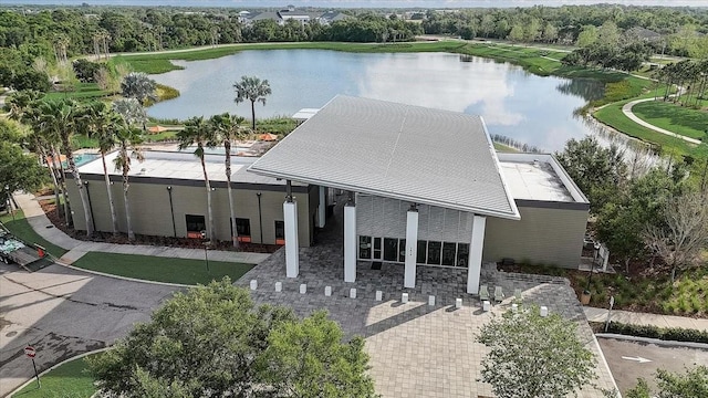 birds eye view of property with a water view