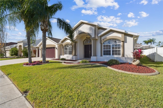 ranch-style home with a front yard and a garage