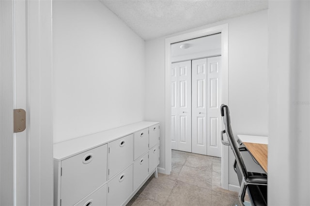 office space featuring a textured ceiling