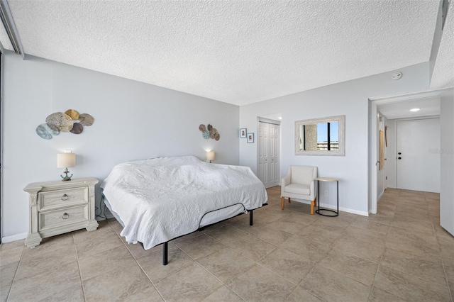 bedroom featuring a closet and a textured ceiling