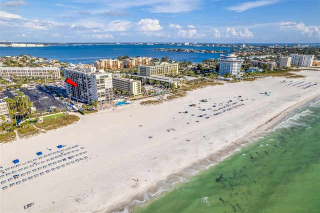 birds eye view of property with a view of the beach and a water view