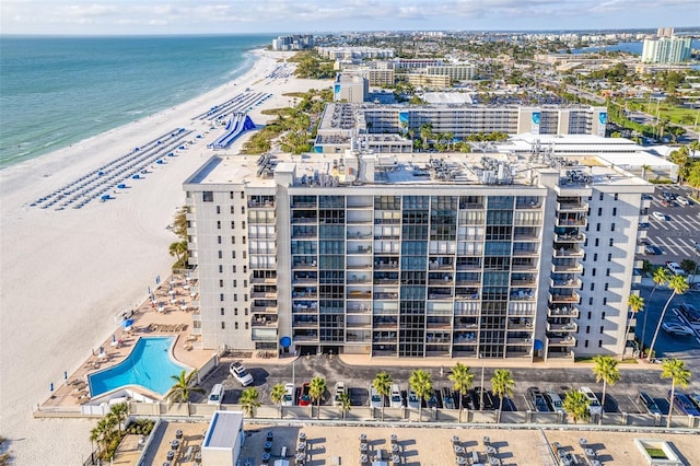 birds eye view of property featuring a view of the beach and a water view