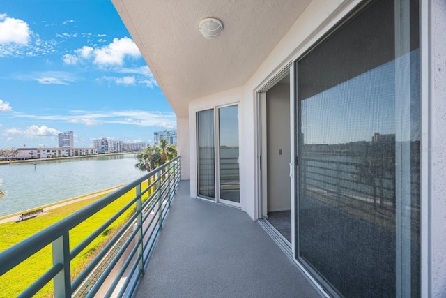 balcony featuring a water view