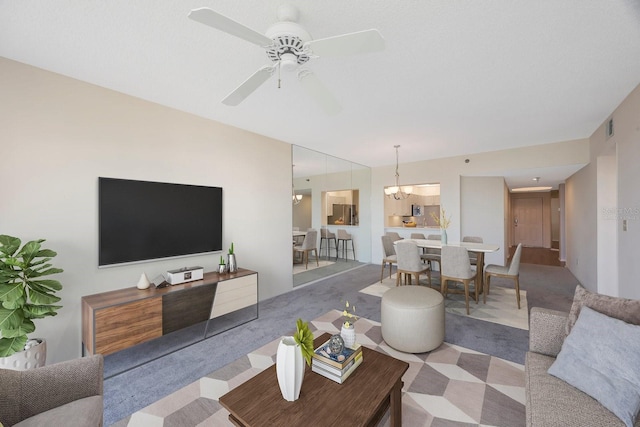 living room featuring light colored carpet and ceiling fan