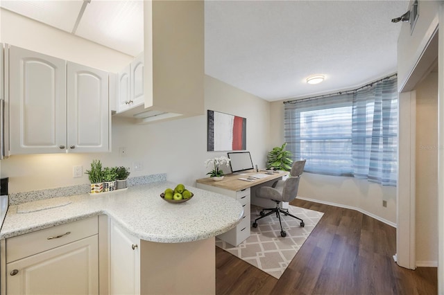 office area with dark hardwood / wood-style flooring