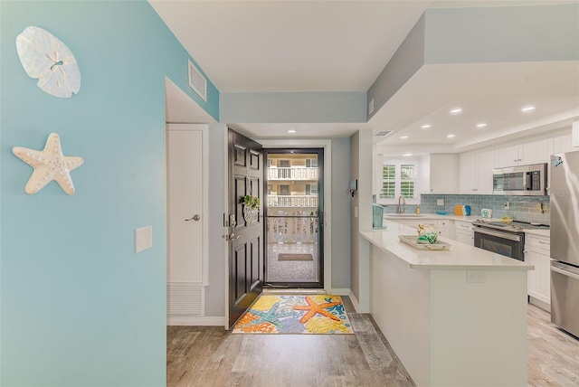 interior space featuring light hardwood / wood-style flooring and sink