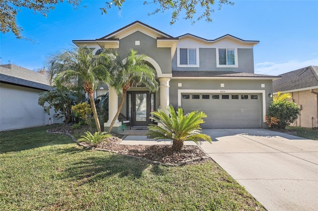 view of front of home with a garage and a front yard