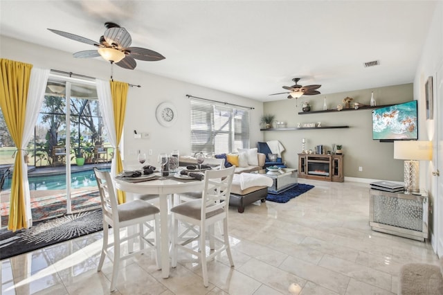 dining area with ceiling fan