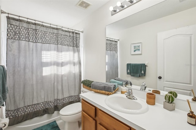 full bathroom featuring vanity, shower / bath combo, and toilet