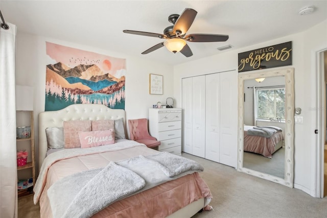 bedroom with carpet, ceiling fan, and a closet