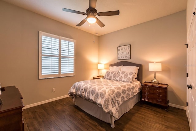 bedroom featuring a ceiling fan, baseboards, and dark wood-type flooring