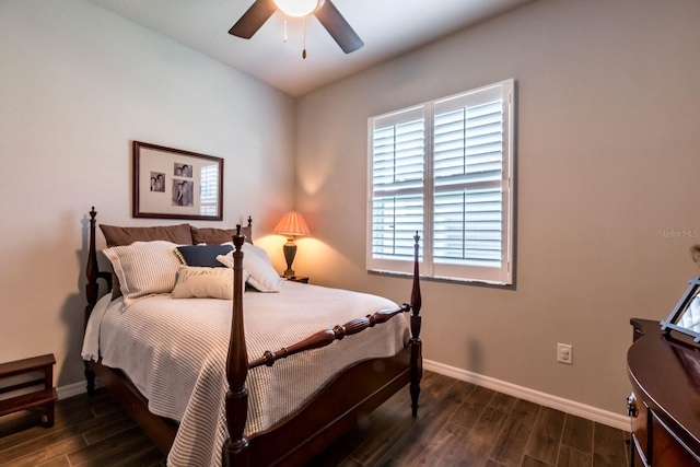 bedroom featuring ceiling fan, dark wood-type flooring, and baseboards