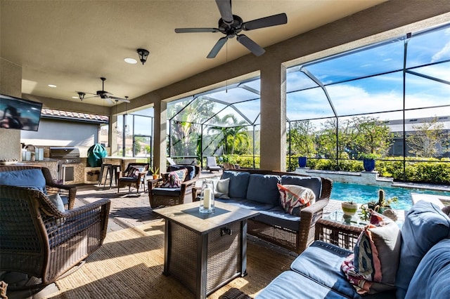 view of patio / terrace featuring grilling area, an outdoor hangout area, glass enclosure, exterior kitchen, and an outdoor pool