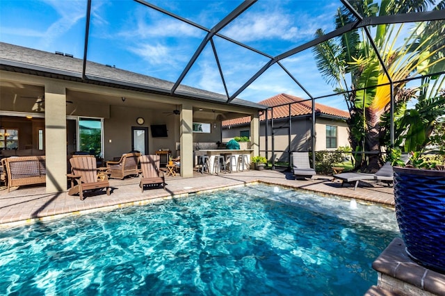 pool featuring outdoor dry bar, a patio area, ceiling fan, a lanai, and an outdoor living space