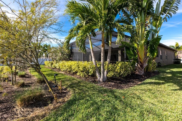 view of yard with a lanai