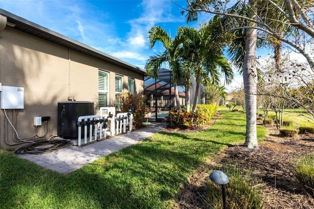 view of yard with a lanai