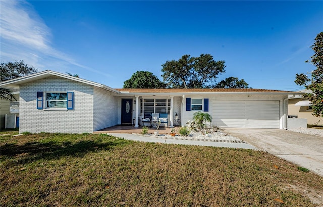 ranch-style home with a porch, a garage, and a front lawn