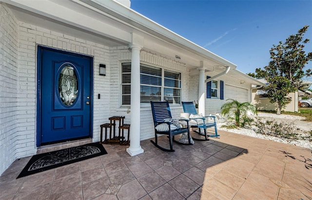 entrance to property with covered porch