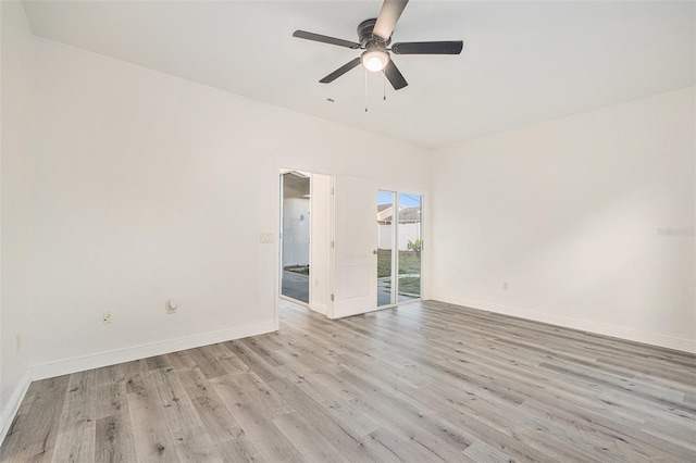 spare room featuring light hardwood / wood-style floors and ceiling fan