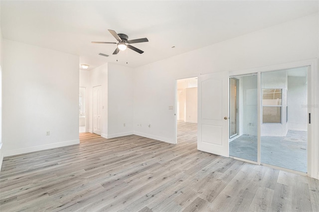 spare room featuring ceiling fan and light hardwood / wood-style floors