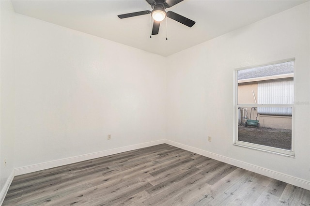 empty room featuring hardwood / wood-style flooring and ceiling fan