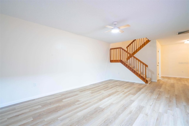 unfurnished room with ceiling fan and light hardwood / wood-style floors