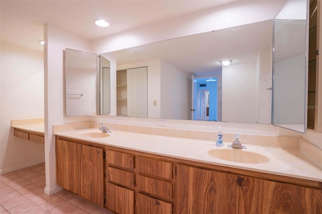 bathroom with tile patterned floors and vanity