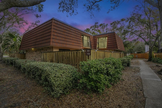 view of property exterior at dusk