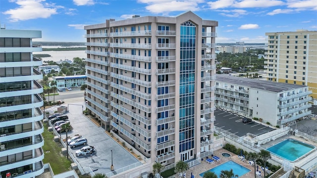 view of property featuring a community pool