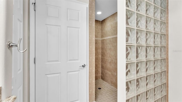 bathroom with tiled shower