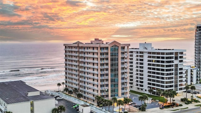 outdoor building at dusk featuring a water view