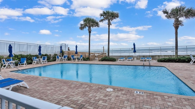 view of swimming pool with a patio area