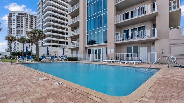 view of swimming pool with a patio