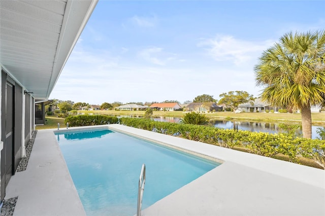 view of pool featuring a water view