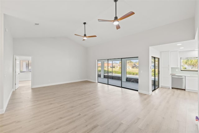 unfurnished living room with ceiling fan, light hardwood / wood-style floors, and high vaulted ceiling