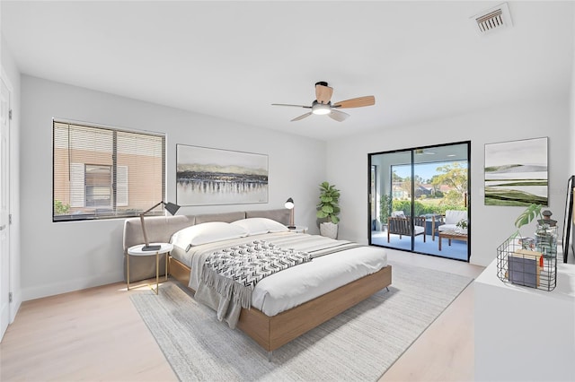 bedroom with ceiling fan, light hardwood / wood-style floors, and access to exterior