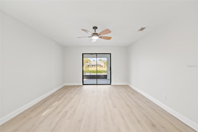 empty room featuring ceiling fan and light hardwood / wood-style floors