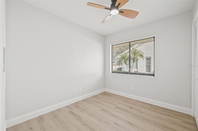 spare room featuring ceiling fan and light wood-type flooring